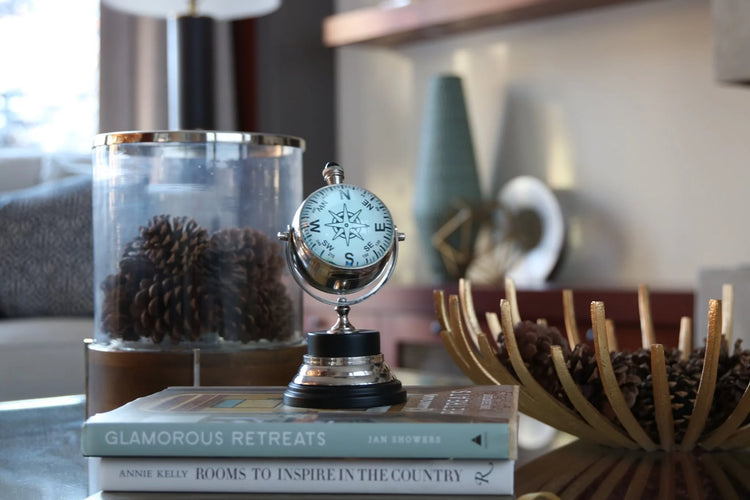 A tabletop arrangement of books and decorative objects, photographed by Billie Parsley-Mitha