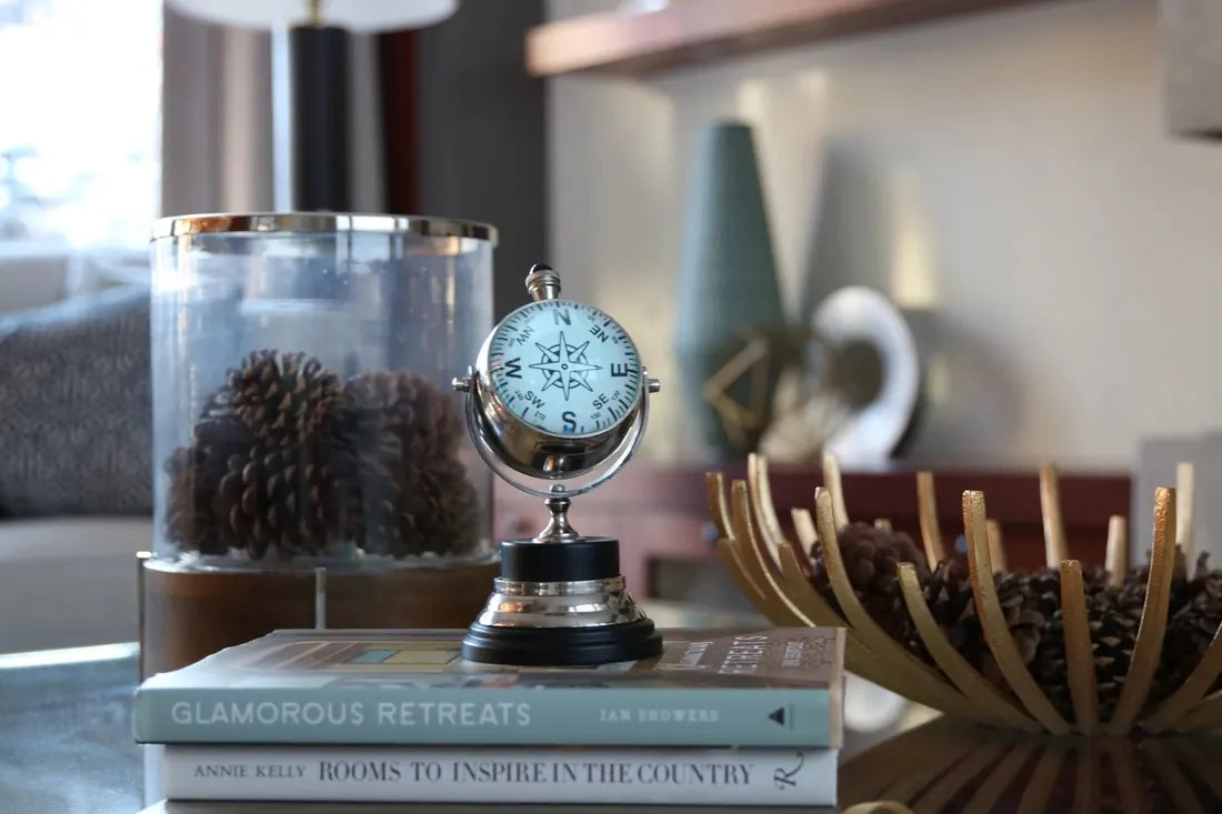 A tabletop arrangement of books and decorative objects, photographed by Billie Parsley-Mitha